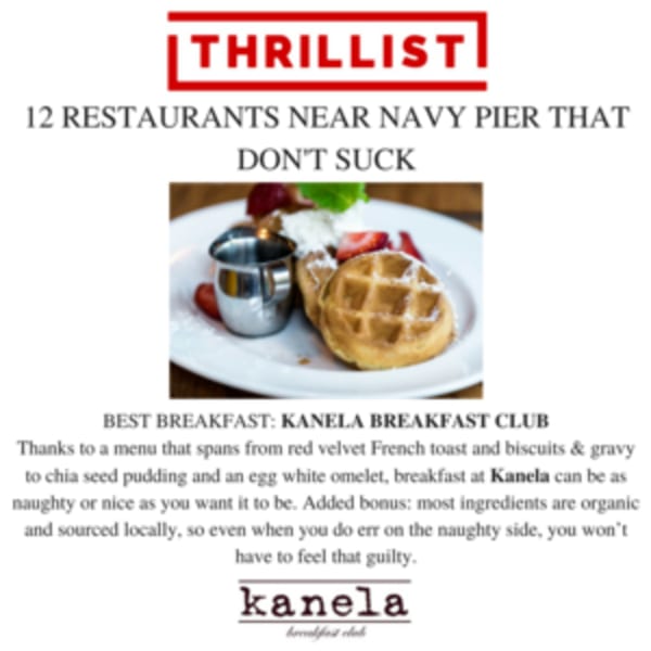 A Kanela Breakfast Club waffle with strawberries, whipped cream, and syrup on a white plate.
